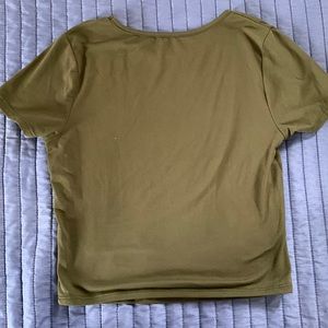 Cute dark green short sleeve crop top. Size small.